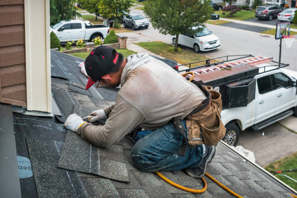 Professional Roofing technician working in East Calais, VT